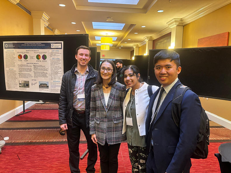 Richard Zhang, M.D. (right), giving a presentation with three of his colleagues in the APA Foundation Fellowships program.