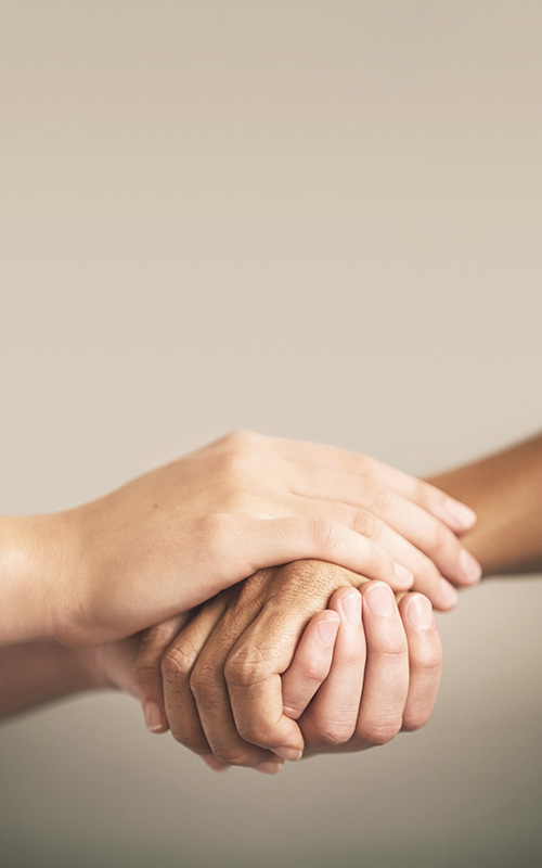 friends holding hands in support