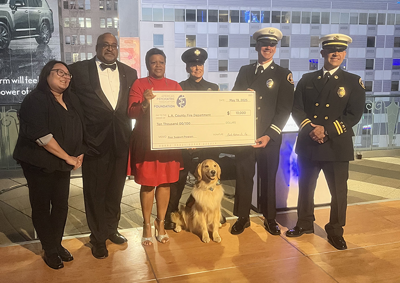 Members of the LA County Fire Department's Peer Support Program accept a gift from the APA Foundation at the Foundation's 2025 Benefit. K9 Peer Support Specialist Bruno joined us at the GRAMMY Museum.