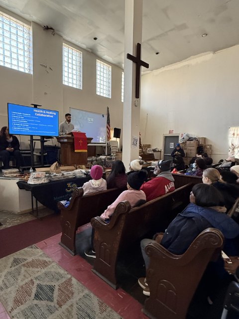 Group of people sitting in a church discussing mental health