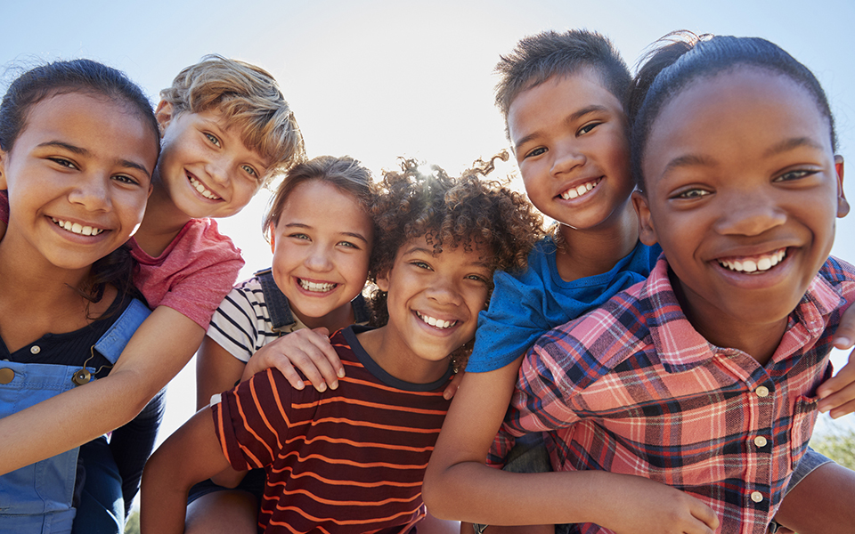 group of children smiling at the camera