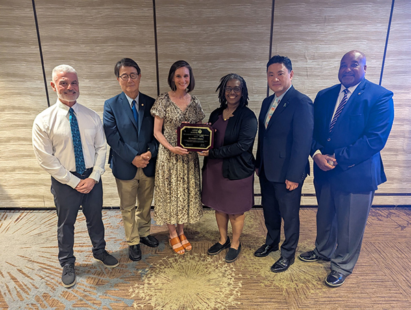 The Women's Initiative receiving award