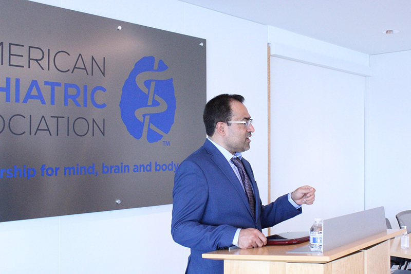 Saeed Ahmed gives a speech at a podium about his award-winning device