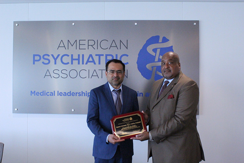 Rawle Andrews presents the O'Leary Award to Saeed Ahmed
